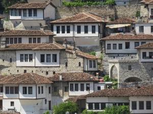 a group of stone houses with tile roofs at Guesthouse RAMAJ in Perondi +26 photos