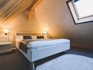 Postel nebo postele na pokoji v ubytování Hôtel Le Dormeur