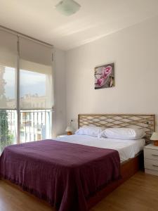 En eller flere senge i et værelse på Prime holiday apartment