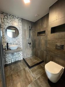 Koupelna v ubytování Villa Deluxe Kvariati