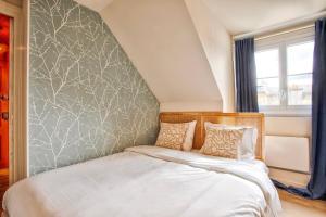 Postel nebo postele na pokoji v ubytování Logement Cozy décoré avec gout