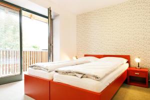 Postel nebo postele na pokoji v ubytování Hotel U Tří volů
