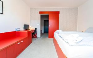 Postel nebo postele na pokoji v ubytování Hotel U Tří volů