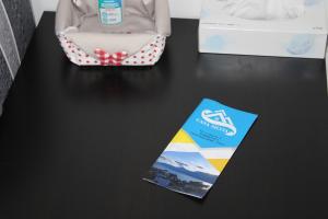 a table with a box and a brochure on it at Casa Silvia in Germignaga