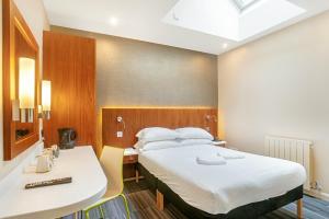 Voodi või voodid majutusasutuse The Place Hotel toas