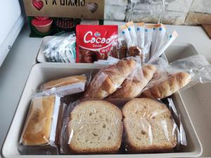 a lunch box filled with bread and croissants at La Romana in Santiponce +9 photos