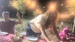 a man and a woman sitting at a picnic table at No alquilar in Cucullú +3 photos