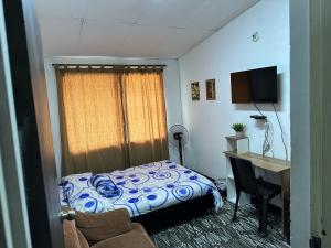 Una cama o camas en una habitación de Casa refugio antojitos