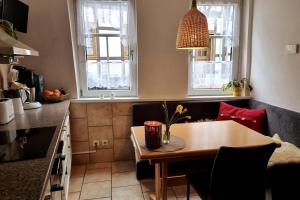 a living room with a table and a couch at Ferienhaus Inge in Stolberg