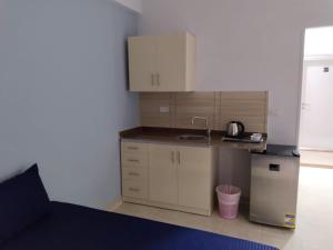 a small kitchen with a counter and a sink at Aquarium Seaview accomodations in Hurghada +4 photos