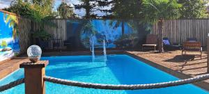 a swimming pool with a rope around it at Ferienwohnung Uhlenbusch Paradise in Friesoythe