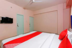 Postel nebo postele na pokoji v ubytování Hotel O Avigna Residency