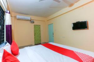 Postel nebo postele na pokoji v ubytování Hotel O Avigna Residency