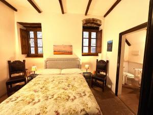 Posteľ alebo postele v izbe v ubytovaní Appartamenti a Pitigliano