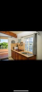 Kuchyň nebo kuchyňský kout v ubytování Le Dodo Appartements
