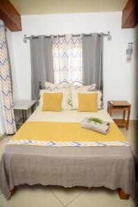 Postel nebo postele na pokoji v ubytování Le Dodo Appartements