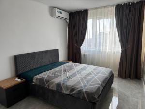 Ένα ή περισσότερα κρεβάτια σε δωμάτιο στο Apartament panoramic