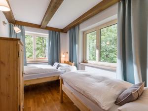 Łóżko lub łóżka w pokoju w obiekcie Chalet Achenberg