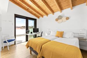 Ένα ή περισσότερα κρεβάτια σε δωμάτιο στο Villa La Tabaiba- Bright open spaces, private & heated pool +29 φωτογραφίες