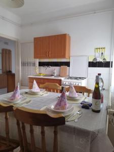 a kitchen with a table with party hats on it at Keszi Széli Vendégház in Gyulakeszi +7 photos