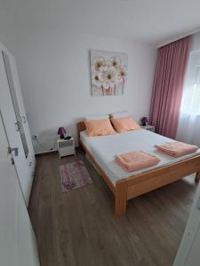 Postel nebo postele na pokoji v ubytování Apartman Jass