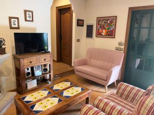 Telewizja i/lub zestaw kina domowego w obiekcie Un Paraiso Junto al Mar