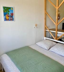 Postel nebo postele na pokoji v ubytování Appartement Hyper Cosy - Vue mer panoramique 180