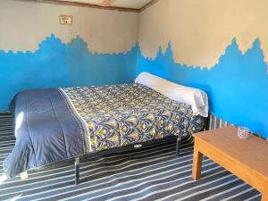Postel nebo postele na pokoji v ubytování Auberge L'Oasis Mhamid