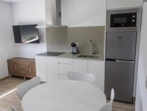 Kuchyň nebo kuchyňský kout v ubytování Alén de Louro - Apartamento 7 Mar de Lira