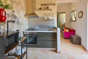 a kitchen with a sink and a stove at LTM greenhouse in Syracuse
