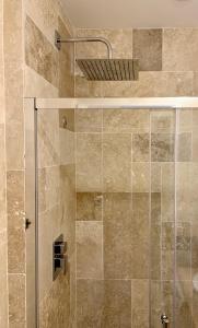 a shower with a glass door in a bathroom at Antibes Old Town Haven in Antibes