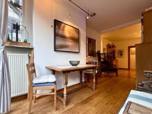 a dining room with a table and chairs at Briller Palais in Wuppertal