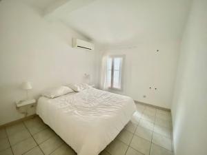 Katil atau katil-katil dalam bilik di Duplex 3 Chambres Proche Gare Clim, WIFI, parking