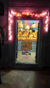 a display of a shrine in a room with lights at Shree Savitri Palace in Pushkar +32 photos