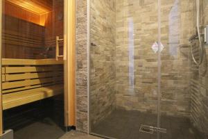 a shower with a glass door in a bathroom at Ferienhaus in Schierke mit Garten in Schierke +31 photos