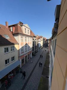 a city street with cats walking down a street at Modernes Serviced Apartment Wohnglück 2 in Ansbach