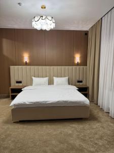 Ένα ή περισσότερα κρεβάτια σε δωμάτιο στο GOLD Hotel & SPA