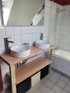 a bathroom with two sinks and a mirror at Entre terre et mer in Plédran +13 photos