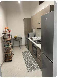 A kitchen or kitchenette at CASA VACANZE VIA CASALE