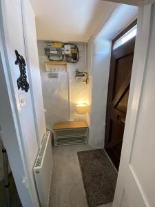a small hallway with a door and a stairway at Golygfa'r Orsaf Snowdonia national park, Bala lake in Bala