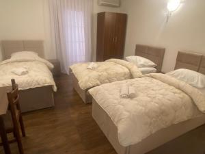 Ένα ή περισσότερα κρεβάτια σε δωμάτιο στο Hotel Damar