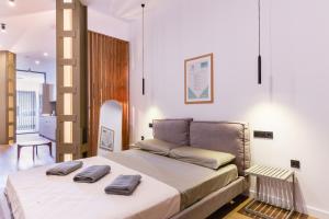 Una cama o camas en una habitación de Mestalla flats & Rut 27 fotos más