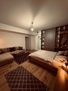 Ένα ή περισσότερα κρεβάτια σε δωμάτιο στο Ideal Apartament