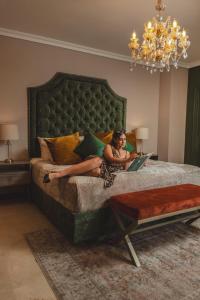 Voodi või voodid majutusasutuse Hotel Osvé Boutique Cali toas