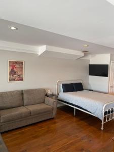 Ένα ή περισσότερα κρεβάτια σε δωμάτιο στο Oasis