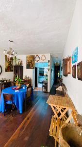 a dining room with a blue table in a room at Hostel Familiar in Salvador +85 photos