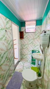a bathroom with a sink and a toilet at Hostel Familiar in Salvador