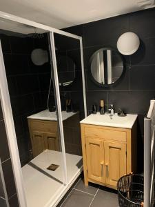 a bathroom with a shower and a sink and a mirror at Maison Amore Serre Chevalier in Saint-Chaffrey +27 photos