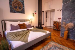 Ένα ή περισσότερα κρεβάτια σε δωμάτιο στο Bašty Apartments