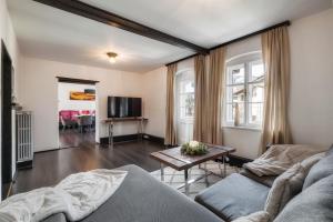 a living room with a couch and a table at NA-Home Kitzbühel Hornbichl in Kitzbühel